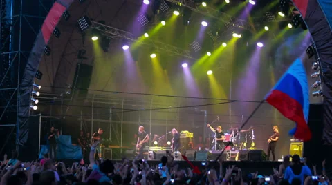 Fans with russian flag at live performance of rock band Bi-2 Stock Footage 31809971