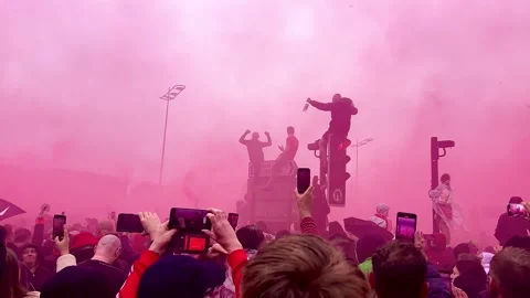 Fans sing on Strand in red smoke during Liverpool parade celebration Stock Footage 311027954