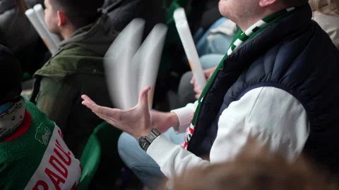 Fans slam sticks creating echoing wave of excitement Vídeos de archivo 321776610