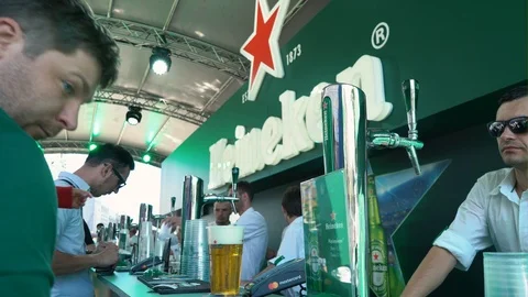 Fans of teams are drinking beer in the fan zone of Kiev. Champions League Stock Footage 90277594