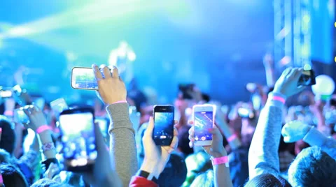 Fans waving their hands and hold the phone with digital displays. Stock Footage 39709593