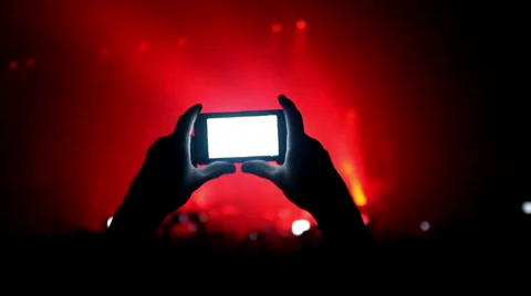 Fans waving their hands and hold the phone with digital displays Stock Footage 55787796