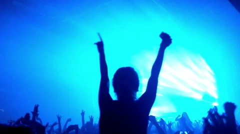 Fans waving their hands and hold the phone with digital displays Stock Footage 55787980
