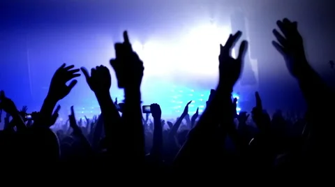 Fans waving their hands and hold the phone with digital displays Stock Footage 55787987
