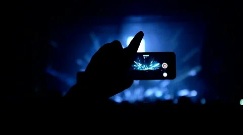 Fans waving their hands and hold the phone with digital displays Stock Footage 61727596