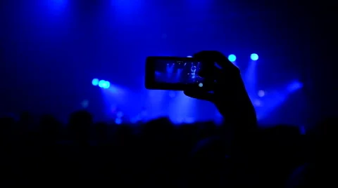 Fans waving their hands and hold the phone with digital displays Stock Footage 61727668