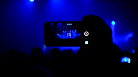Fans waving their hands and hold the phone with digital displays Stock Footage 61727729