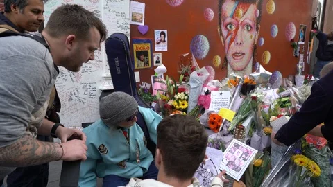 Fans writing messages on mural David Bowie death - January 2016, London (4K) Stock Footage 119935819