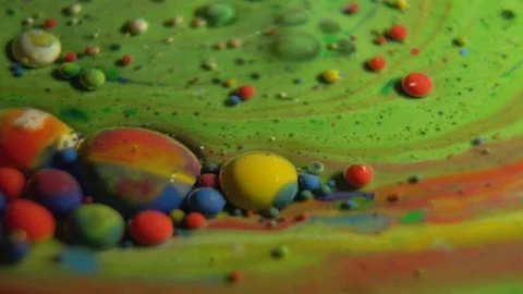 Fantastic abstract paint bubbles moving in slow motion. Chemical reaction of Stock Footage 87234811