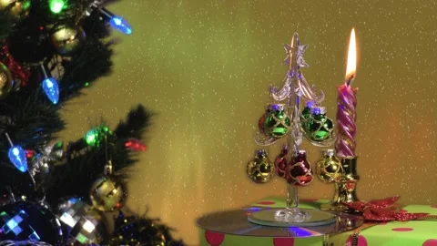 Fantastic background. Large green tree with lights. Burning candle. Stock-Footage 145408591