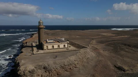 Fantastic circular aerial shot at medium distance over the lighthouse of Stock Footage 208028418