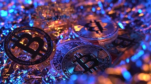 Fantastic close up macro shot of 5 gold Bitcoin BTC with grat golden and blue Video stock 129804740