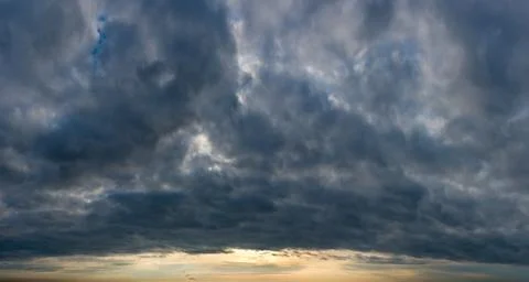 Fantastic clouds at sunrise Stock Photos