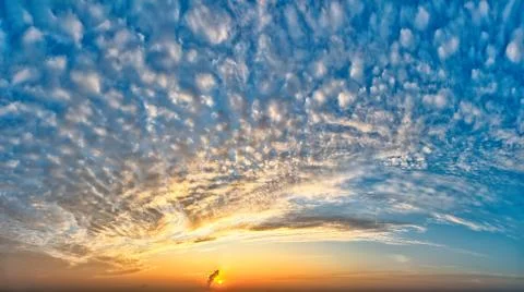 Fantastic clouds at sunrise Stock Photos