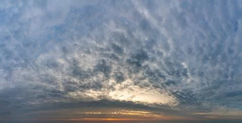 Fantastic clouds at sunrise Stock Photos