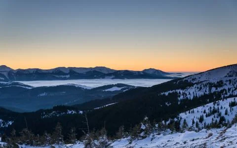 Fantastic evening winter landscape. Dramatic sky. Stock Photos