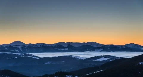 Fantastic evening winter landscape. Dramatic sky. Stock Photos