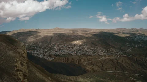 Fantastic rural landscape, mountain surrounded village, drone flies over summits Stock Footage 165568898