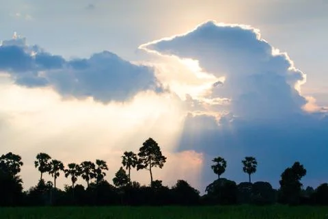 Fantastic sunset sky, cloud formations, look like a giant Godzilla with fire- Stock Photos