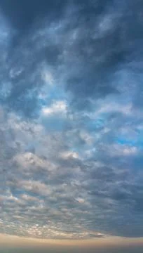 Fantastic thunderclouds at sunrise, vertical panorama Stock Photos
