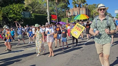 FANTASTIC VIEW OF CROWDS MARCHING IN SUPPORT OF AUSTRALIAN REFERENDUM THE VOICE Stock Footage 250446422
