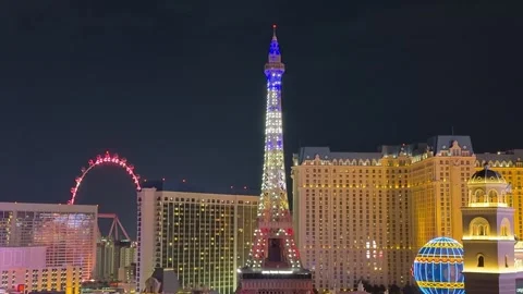 Fantastic view of the Eiffel Tower in Las Vegas lit up at night in Red, White Stock Footage 317991977