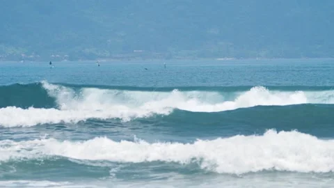 Fantastic view of massive barrel waves splashing and breaking in the blue sea. Stock Footage 154534604