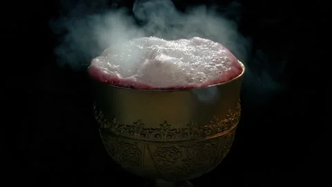 Fantasy Bubbling Drink In Gold Cup Stock Footage 135404398