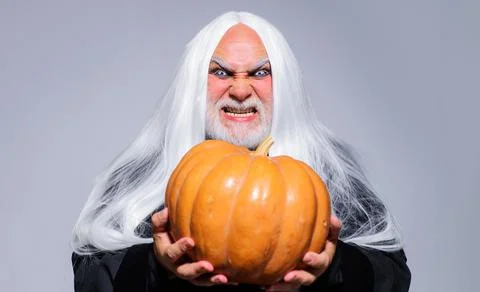 Fantasy horror Halloween. Wicked Devil man with Jack-o-lantern. Angry Demon o Stock Photos