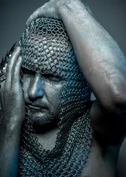 Fantasy, medieval executioner mesh iron rings on the head Stock Photos