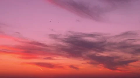 Fantasy multi colored sunset sky sun and and feathery clouds multi colors fast t Stock Footage 326791429