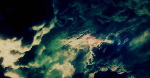 Fantasy Storm Clouds in Various Colors are Passing Through Stock Footage 77699132
