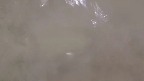 Fantasy sun rays reflection on the sea water surface with sand in slow motion Vídeos de archivo 70361388