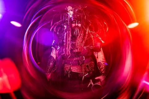 Fantasy Viking Warrior Standing in Red and Purple Light Rings Stock Photos