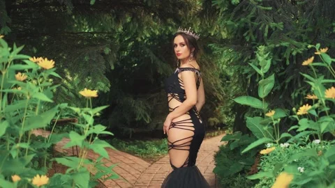 Fantasy woman dark queen posing sexy body. Adult girl princess look at camera Stock Footage 307843757
