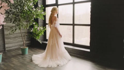 Fantasy woman looking out window waiting for love. White long vintage dress 4k Stock Footage 234719007