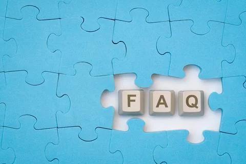 FAQ message on the computer keyboard keys placed among blue puzzle FAQ mes... 스톡 사진