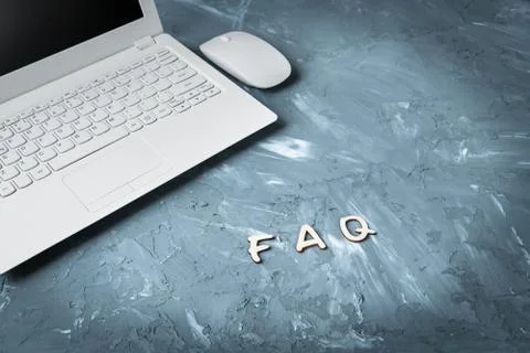 Faq Question and answer Information concept - Laptop and computer mouse on ta Stock Photos
