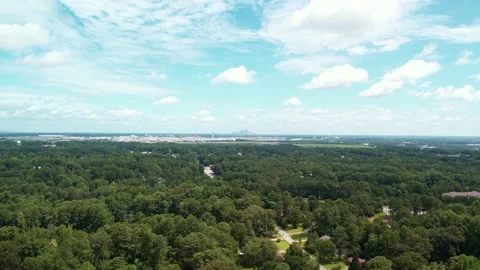 Far away aerial drone pull away from airport city Stock Footage 170721556