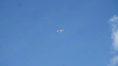 Far away plane Stock Footage 303399505