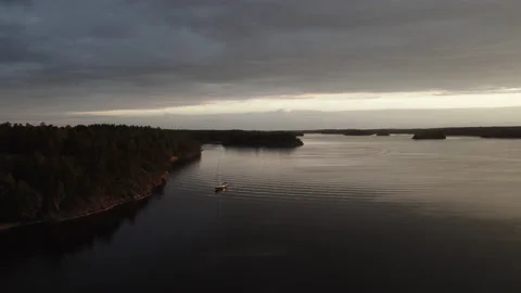 Far away sail boat in the distant horizon - aerial, Baltic Sea night Stock Footage 156902665