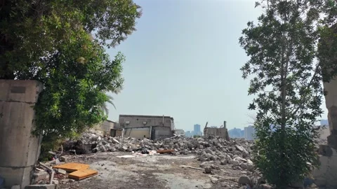 Far from the modern skyline of the UAE, abandoned structures stand quietly Stock Footage 335947388