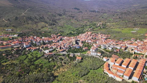 Far Pullback From Acebo Church Over Village and Hills Stock Footage 336561176