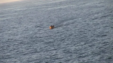 Far view of small boat on calm sea Stock Footage 92860410