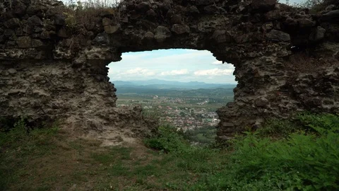 Far view of a town in basin from old Khust fortress with mountains and sky on Video stock 114443827