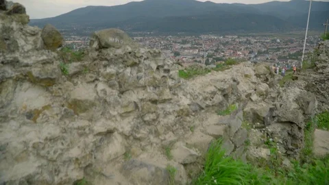 Far view of a town in basin from old Khust fortress with mountains and sky on Stock Footage 114444063