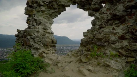 Far view of a town in basin from old Khust fortress with mountains and sky on Stock Footage 114444402