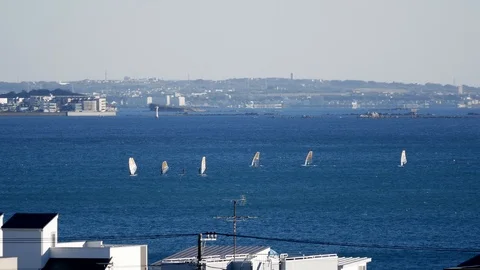 Far view of windsurfing Stock Footage 102124411