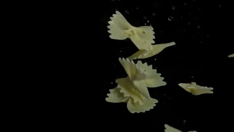 Farfale paste falls into the water Stockbeeldmateriaal 194215650