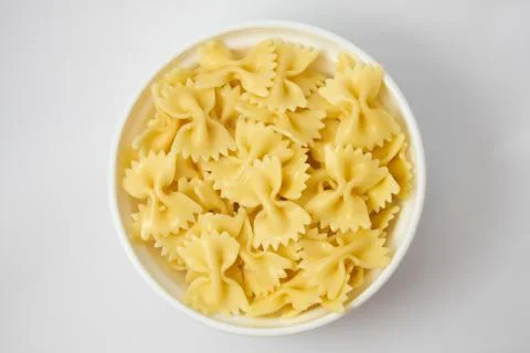 Farfalle into the pot Stock Photos